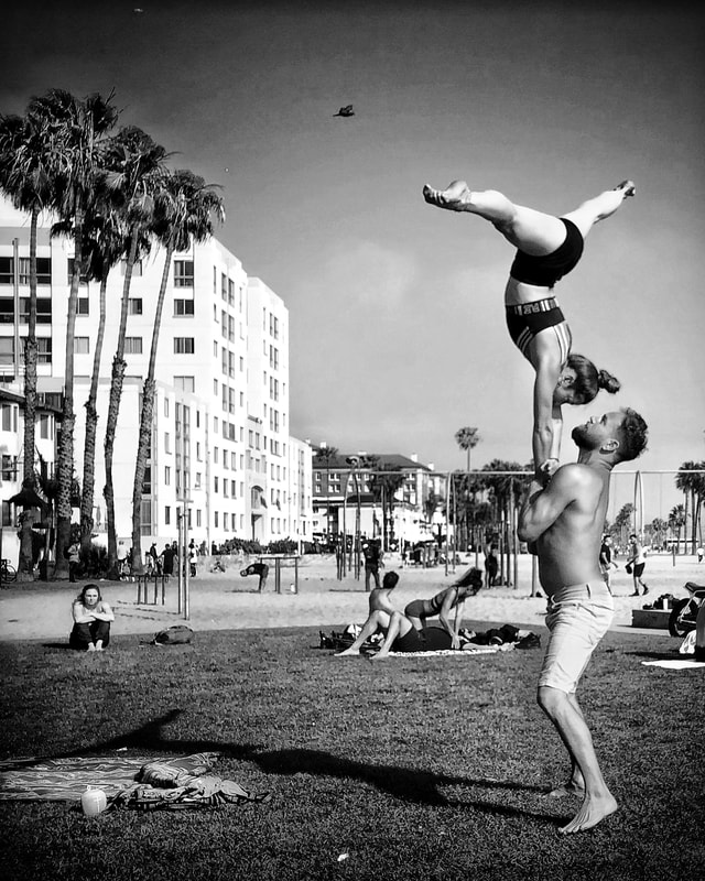Acrobats, Muscle Beach, Santa Monica, California, street photography, black and white, performers, john nieto. Mobile photography